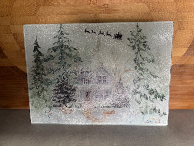 santa flying over snowy house worktop saver/ chopping board